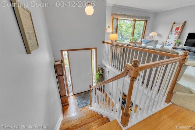 23637 Cranbrooke Dr, Novi, MI 48375 - staircase with crown molding and wood finished floors