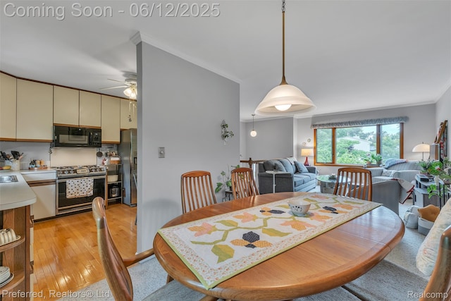23637 Cranbrooke Dr, Novi, MI 48375 - dining area featuring light wood finished floors, a ceiling fan, and crown molding