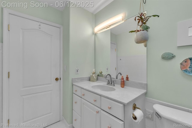 23637 Cranbrooke Dr, Novi, MI 48375 - bathroom with vanity, toilet, and a wainscoted wall