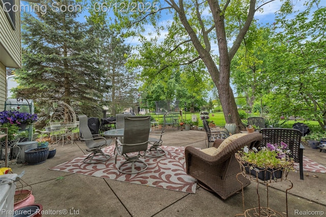 23637 Cranbrooke Dr, Novi, MI 48375 - view of patio / terrace with outdoor dining space and view of wooded area