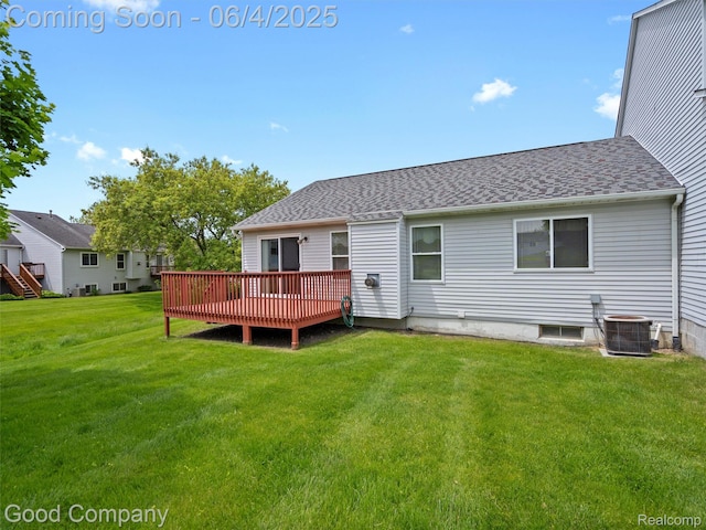 864 Challenging Trl, South Lyon, MI 48178 - rear view of house featuring central air condition unit, a wooden deck, a yard, and a shingled roof