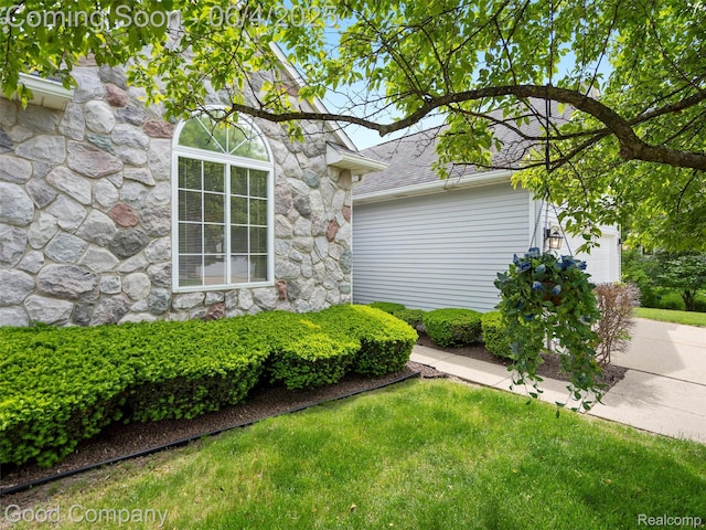 864 Challenging Trl, South Lyon, MI 48178 - view of home's exterior with stone siding