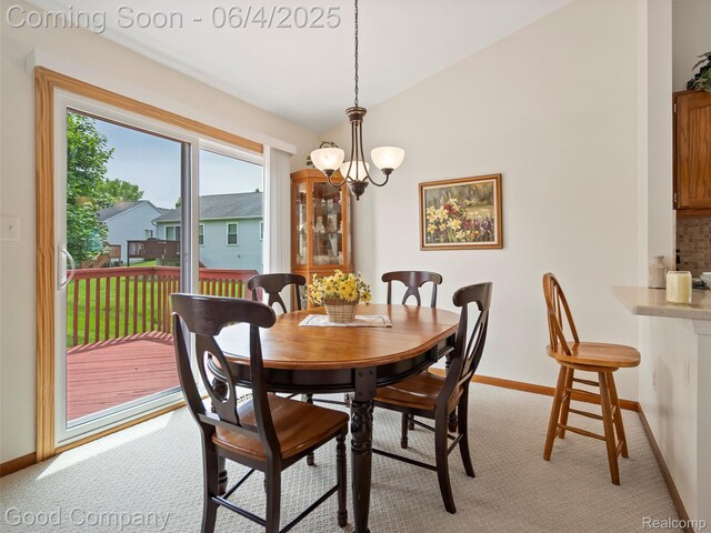 864 Challenging Trl, South Lyon, MI 48178 - dining room featuring light carpet, a chandelier, and baseboards