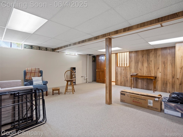 864 Challenging Trl, South Lyon, MI 48178 - below grade area featuring a drop ceiling, carpet floors, and wood walls