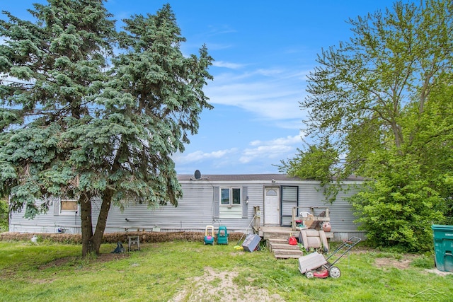 8305 Goodwin Rd, Lyons, MI 48851 - back of property featuring a lawn
