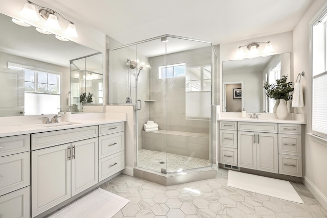 3099 Millbury Ln, Ann Arbor, MI 48105 - bathroom with a stall shower, two vanities, and baseboards