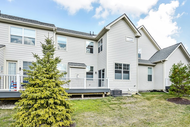 3099 Millbury Ln, Ann Arbor, MI 48105 - back of property featuring a deck, central air condition unit, and a lawn