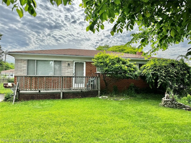 32008 Bunert Rd, Warren, MI 48088 - back of house featuring a yard and brick siding