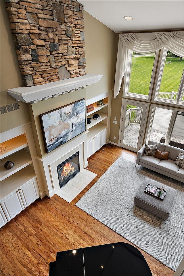 998 Eagle Ave, Ann Arbor, MI 48103 - living room with a tiled fireplace and wood finished floors