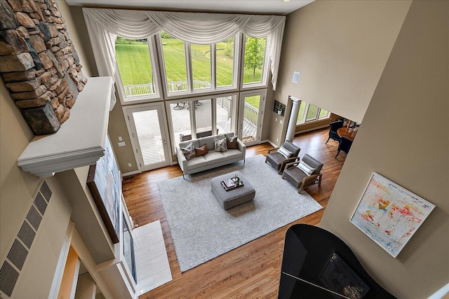 998 Eagle Ave, Ann Arbor, MI 48103 - living room with a high ceiling, wood finished floors, and baseboards