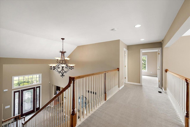 998 Eagle Ave, Ann Arbor, MI 48103 - corridor with a chandelier, an upstairs landing, light carpet, baseboards, and recessed lighting