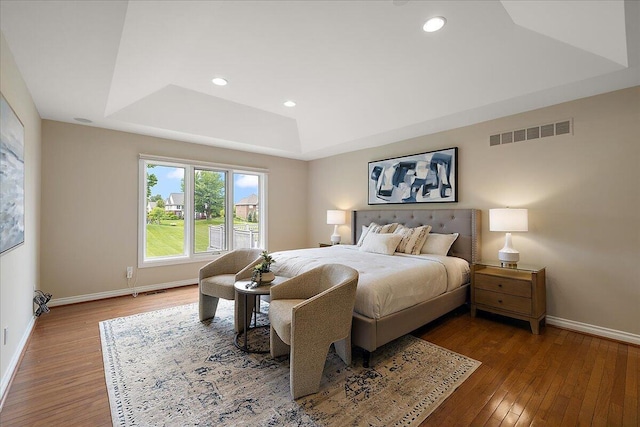 998 Eagle Ave, Ann Arbor, MI 48103 - bedroom featuring a raised ceiling, wood-type flooring, baseboards, and recessed lighting
