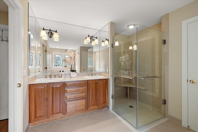 998 Eagle Ave, Ann Arbor, MI 48103 - bathroom with double vanity, a shower stall, and tile patterned floors