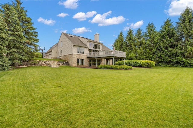 998 Eagle Ave, Ann Arbor, MI 48103 - back of house featuring a yard, a chimney, and a deck