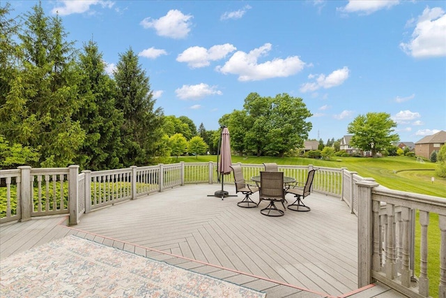 998 Eagle Ave, Ann Arbor, MI 48103 - wooden deck featuring outdoor dining space and a lawn