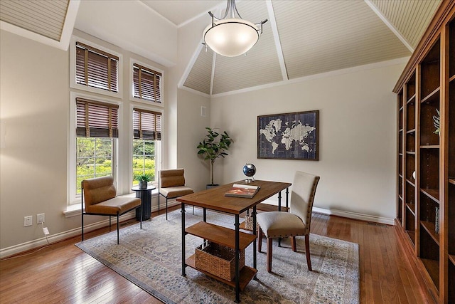 998 Eagle Ave, Ann Arbor, MI 48103 - dining area with baseboards, wood-type flooring, and high vaulted ceiling