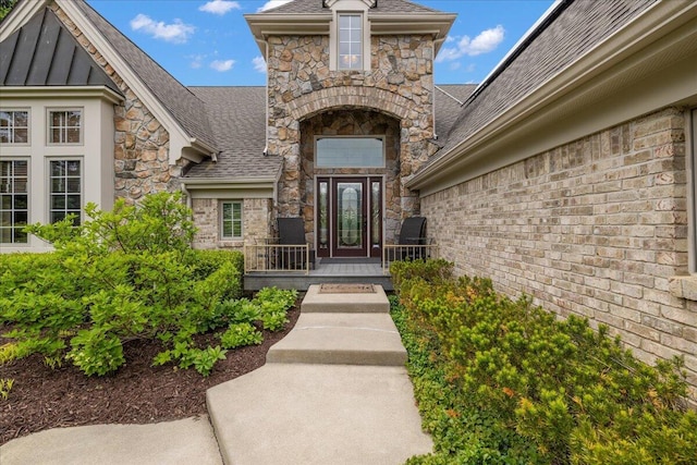 998 Eagle Ave, Ann Arbor, MI 48103 - doorway to property with stone siding and a shingled roof
