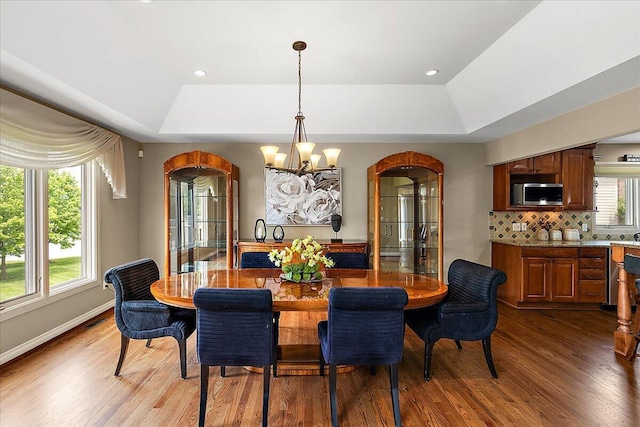 998 Eagle Ave, Ann Arbor, MI 48103 - dining area with a tray ceiling, a chandelier, light wood-type flooring, baseboards, and recessed lighting