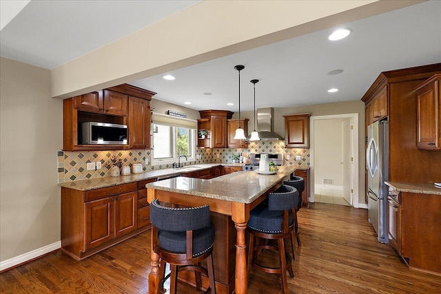 998 Eagle Ave, Ann Arbor, MI 48103 - kitchen featuring wall chimney range hood, appliances with stainless steel finishes, open shelves, dark wood-type flooring, and recessed lighting