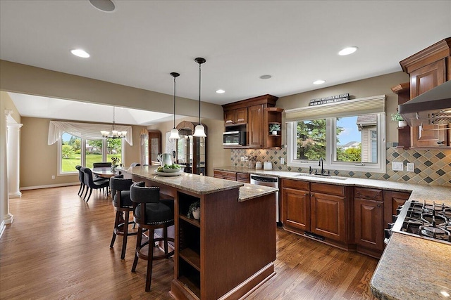 998 Eagle Ave, Ann Arbor, MI 48103 - kitchen with open shelves, a sink, stainless steel appliances, a center island, and recessed lighting