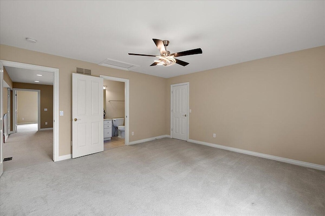 998 Eagle Ave, Ann Arbor, MI 48103 - unfurnished bedroom featuring light carpet, baseboards, ensuite bathroom, and a ceiling fan