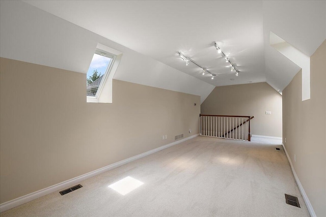 998 Eagle Ave, Ann Arbor, MI 48103 - additional living space featuring lofted ceiling, carpet floors, and baseboards