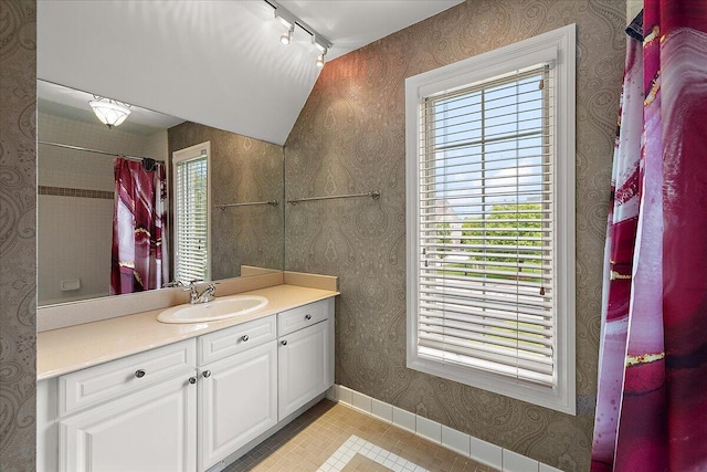 998 Eagle Ave, Ann Arbor, MI 48103 - full bath with vanity, rail lighting, baseboards, tile patterned floors, and wallpapered walls