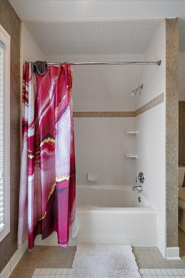 998 Eagle Ave, Ann Arbor, MI 48103 - full bathroom featuring tile patterned floors, toilet, shower / bath combo with shower curtain, and wallpapered walls