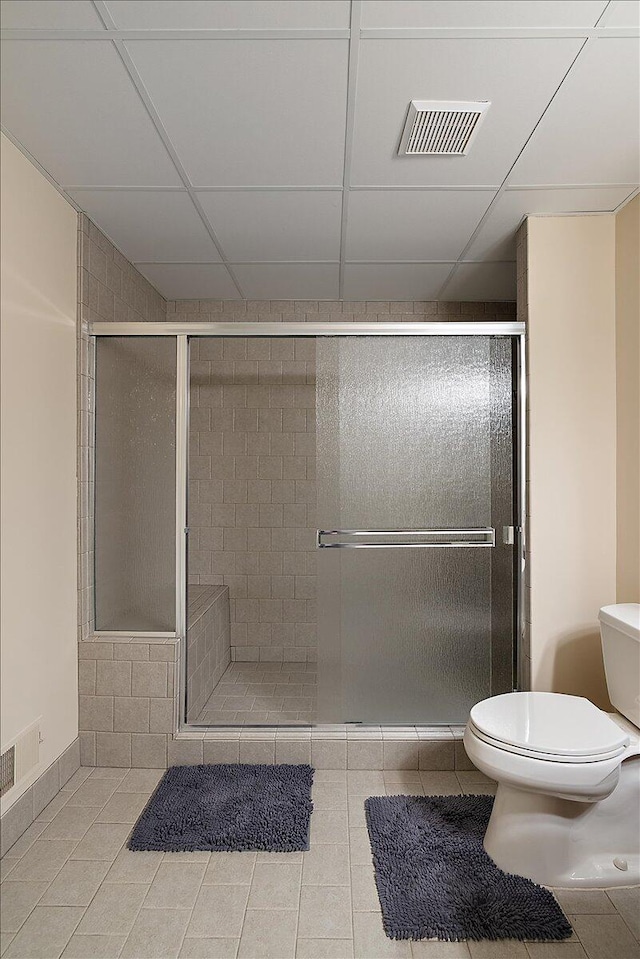 998 Eagle Ave, Ann Arbor, MI 48103 - bathroom with toilet, a shower stall, and tile patterned flooring