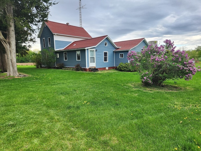 1232 Smoker Rd, Bronson, MI 49028 - back of house featuring entry steps, a yard, and a shingled roof