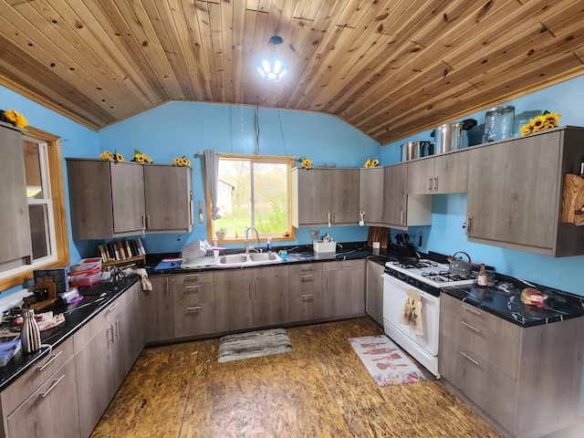 1232 Smoker Rd, Bronson, MI 49028 - kitchen featuring white range with gas stovetop, dark countertops, lofted ceiling, a sink, and wood ceiling