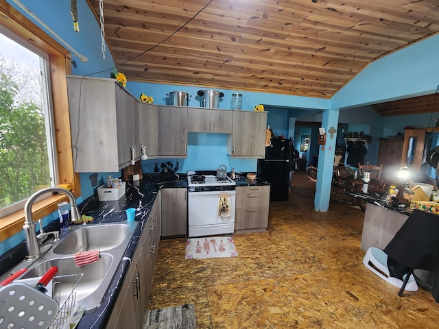 1232 Smoker Rd, Bronson, MI 49028 - kitchen with gas range gas stove, vaulted ceiling, dark countertops, wooden ceiling, and a sink