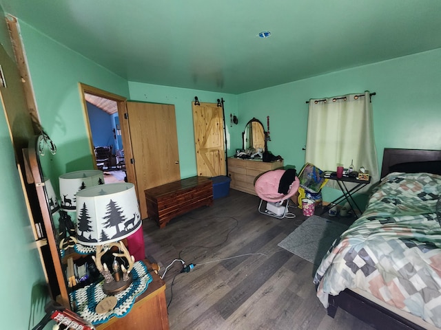 1232 Smoker Rd, Bronson, MI 49028 - bedroom with wood finished floors and a barn door