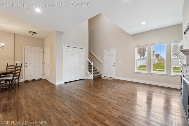 1720 Carlisle St, Howell, MI 48855 - living area with a fireplace, stairway, dark wood-style floors, baseboards, and recessed lighting
