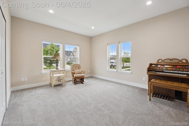 1720 Carlisle St, Howell, MI 48855 - living area with carpet floors, baseboards, and recessed lighting