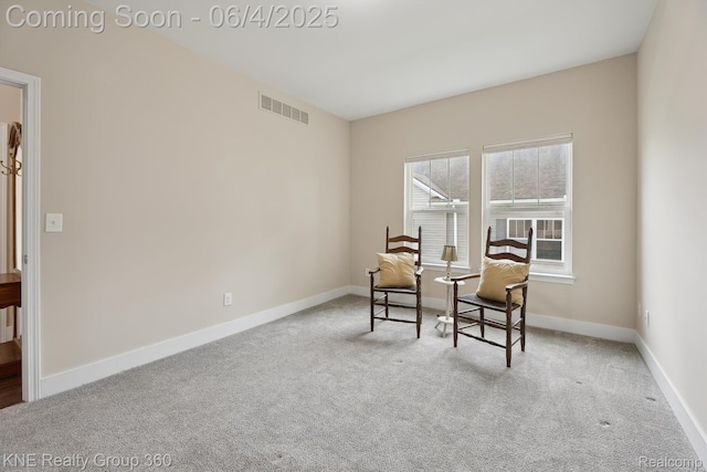 1720 Carlisle St, Howell, MI 48855 - living area featuring carpet floors and baseboards