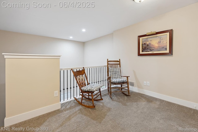 1720 Carlisle St, Howell, MI 48855 - living area with carpet, baseboards, recessed lighting, and an upstairs landing