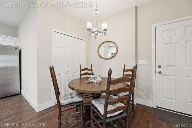 1720 Carlisle St, Howell, MI 48855 - dining room with dark wood-style flooring, baseboards, and a chandelier