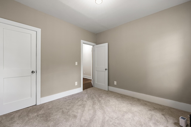 1174 Taylor St, Detroit, MI 48202 - unfurnished bedroom with carpet and baseboards
