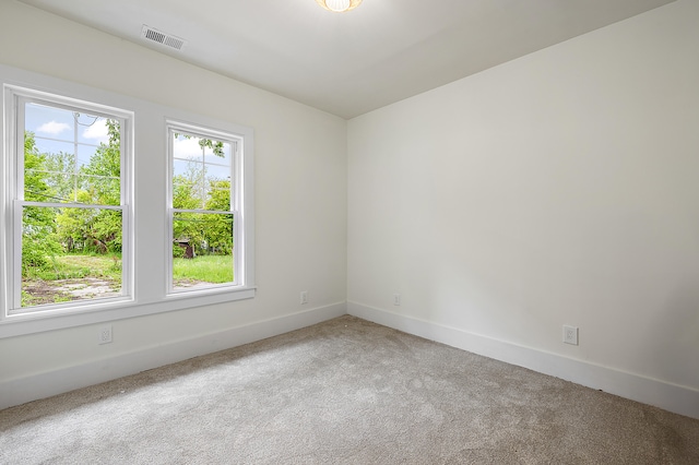 1174 Taylor St, Detroit, MI 48202 - carpeted empty room with baseboards