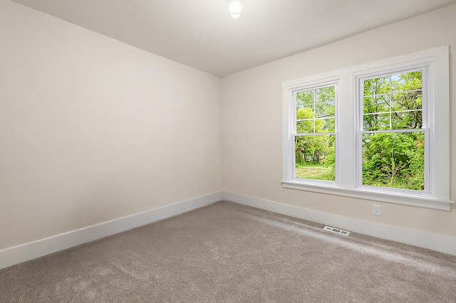 1174 Taylor St, Detroit, MI 48202 - spare room featuring carpet flooring and baseboards