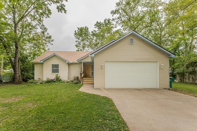 242 S Wallace Blvd, Ypsilanti, MI 48197 - ranch-style house featuring concrete driveway, an attached garage, and a front lawn