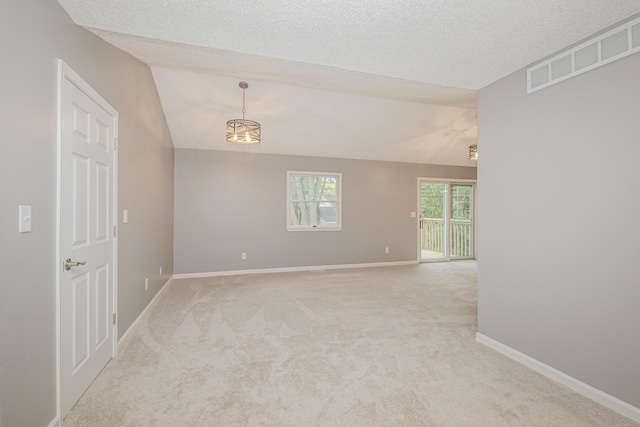 242 S Wallace Blvd, Ypsilanti, MI 48197 - spare room featuring lofted ceiling, light carpet, a textured ceiling, and baseboards