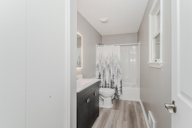 242 S Wallace Blvd, Ypsilanti, MI 48197 - full bathroom featuring vanity, wood finished floors, toilet, shower / bath combo with shower curtain, and baseboards