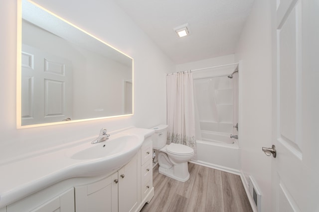 242 S Wallace Blvd, Ypsilanti, MI 48197 - bathroom featuring toilet, vanity, wood finished floors, and shower / tub combo with curtain