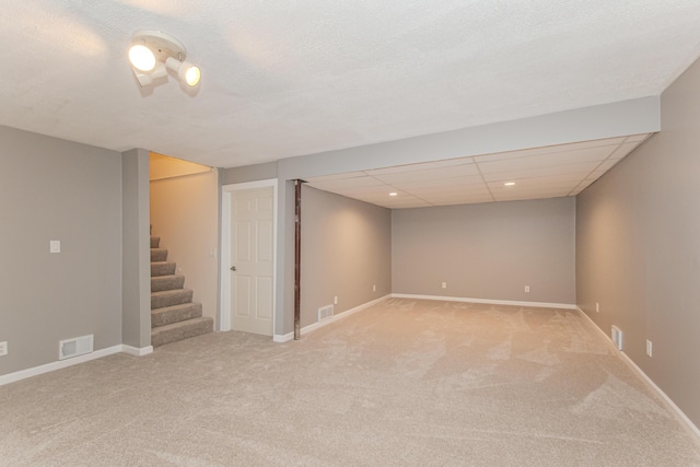 242 S Wallace Blvd, Ypsilanti, MI 48197 - finished basement with light colored carpet, stairway, and baseboards