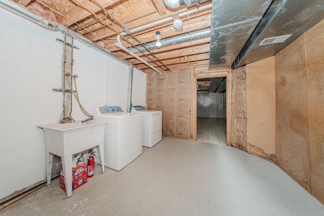 242 S Wallace Blvd, Ypsilanti, MI 48197 - unfinished basement featuring washing machine and dryer