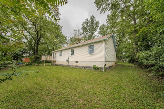 242 S Wallace Blvd, Ypsilanti, MI 48197 - view of property exterior with a lawn, a wooden deck, and roof with shingles
