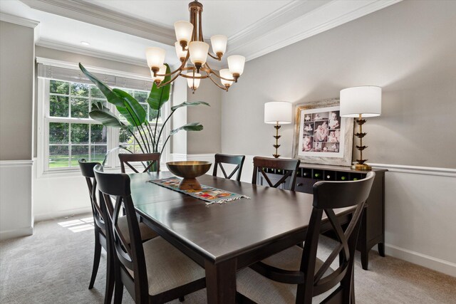 71438 Forest Eagle Ln, Niles, MI 49120 - dining area featuring light colored carpet, ornamental molding, a chandelier, and baseboards