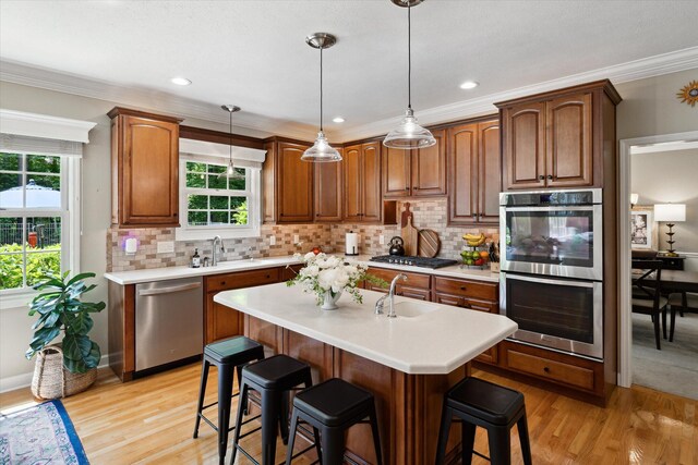 71438 Forest Eagle Ln, Niles, MI 49120 - kitchen featuring stainless steel appliances, light countertops, healthy amount of natural light, crown molding, and recessed lighting